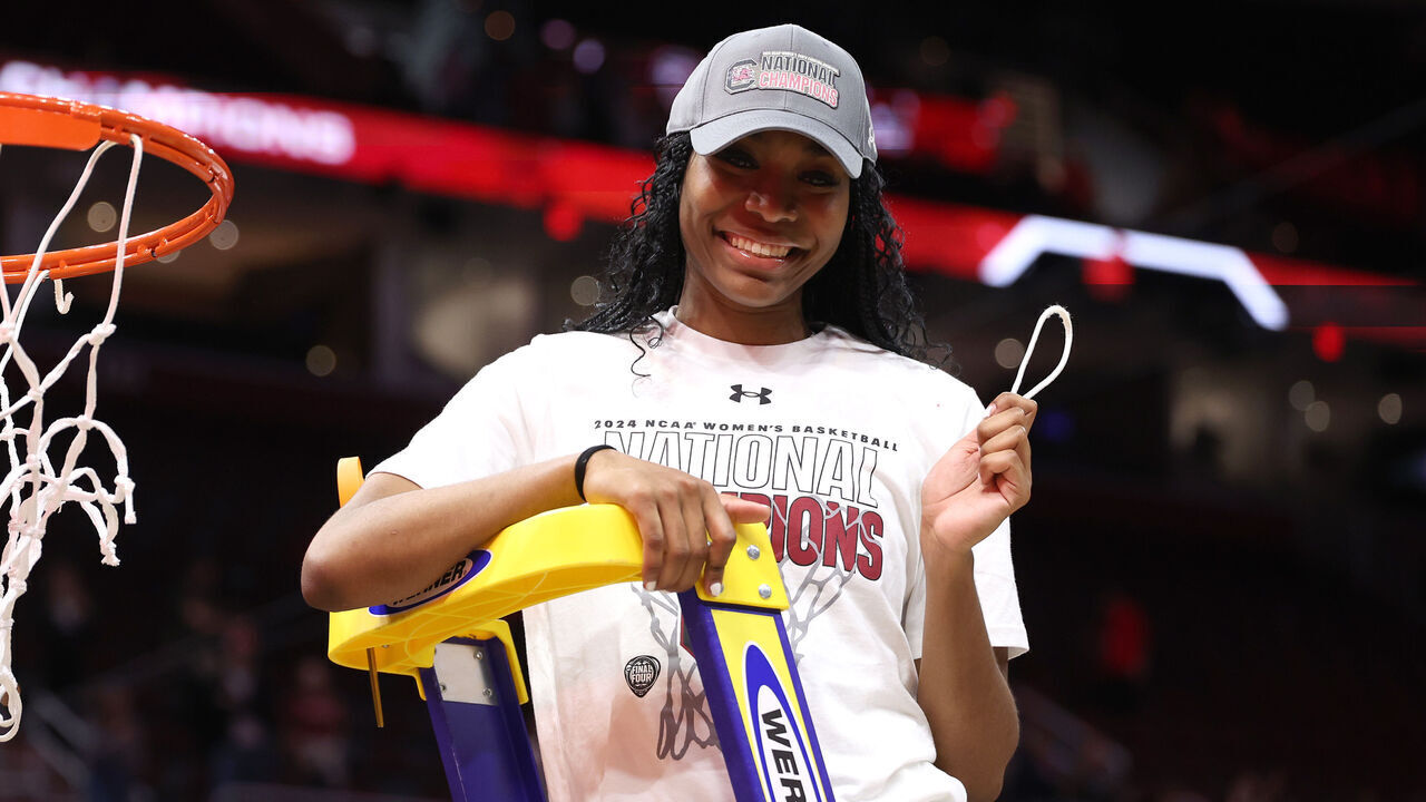 CLEVELAND, OHIO - APRIL 07: Bree Hall #23 of the South Carolina Gamecocks cuts down the net after beating the Iowa Hawkeyes in the 2024 NCAA Women's Basketball Tournament National Championship at Rocket Mortgage FieldHouse on April 07, 2024 in Cleveland, Ohio. South Carolina beat Iowa 87-75.