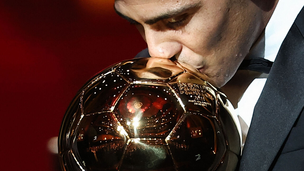 Manchester City's Spanish midfielder Rodri kisses the trophy as he receives the Ballon d'Or award during the 2024 Ballon d'Or France Football award ceremony at the Theatre du Chatelet in Paris on October 28, 2024.