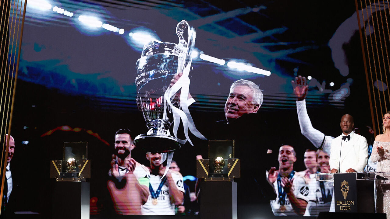 Real Madrid's Italian coach Carlo Ancelotti (screen) receives the Johan Cruyff Best Male Club team's Head Coach of the Year trophy during the 2024 Ballon d'Or France Football award ceremony at the Theatre du Chatelet in Paris on October 28, 2024.