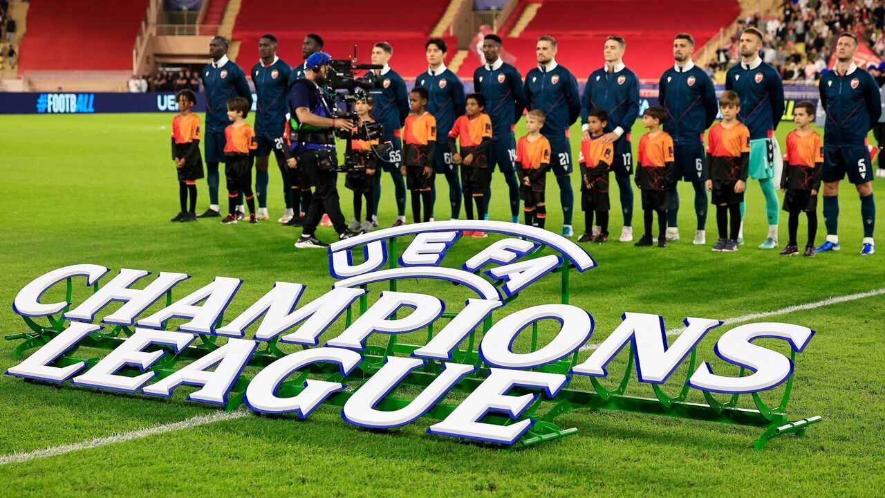 Crvena Zvezda's players line up beside a competition logo prior to the UEFA Champions League, League phase - Matchday 3, football match between AS Monaco and FK Crvena Zvezda (Red Star Belgrade) at the Louis II Stadium in Monaco, on October 22, 2024.