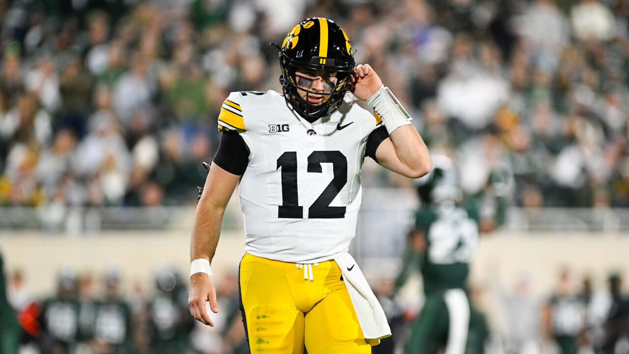 EAST LANSING, MI - OCTOBER 19: Iowa Hawkeyes quarterback Cade McNamara (12) walks off the field after a three-and-out during a college football game between the Michigan State Spartans and the Iowa Hawkeyes on October 19, 2024, at Spartan Stadium in East Lansing, MI.