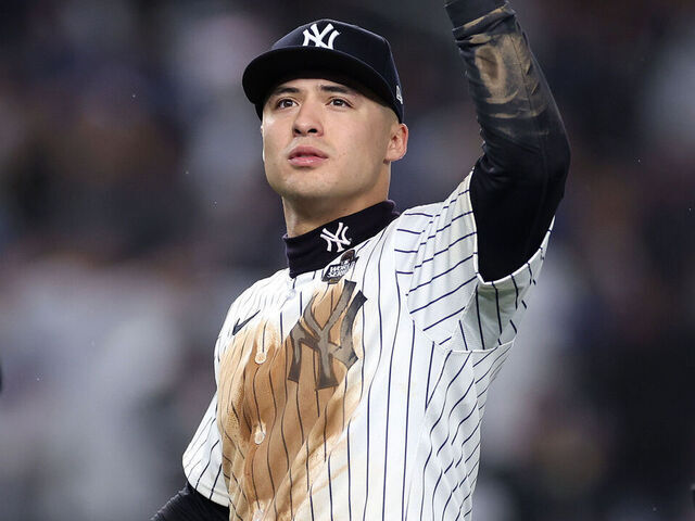 NEW YORK, NEW YORK - OCTOBER 29: Anthony Volpe #11 of the New York Yankees waves toward the crowd after the Yankees defeated the Los Angeles Dodgers 11-4 to win Game Four of the 2024 World Series at Yankee Stadium on October 29, 2024 in the Bronx borough of New York City.