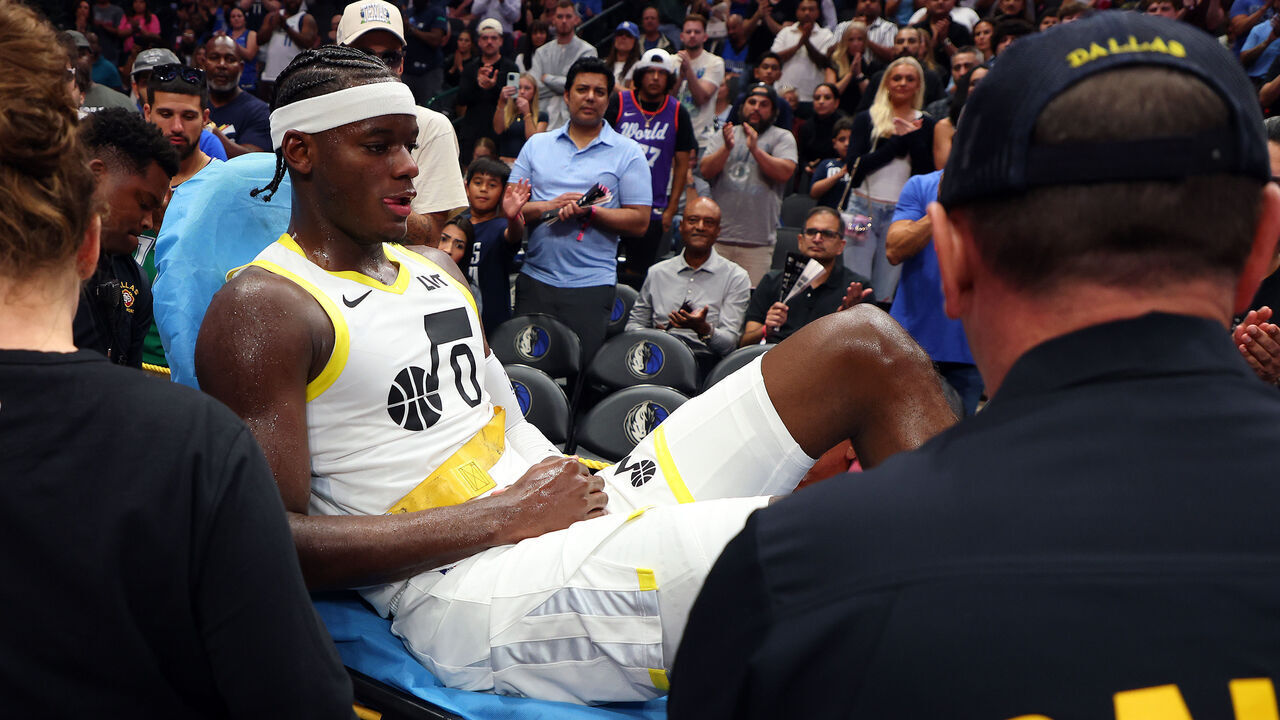 DALLAS, TEXAS - OCTOBER 28: Taylor Hendricks #0 of the Utah Jazz is wheeled out on a gurney after being injured in the third quarter of a game against the Dallas Mavericks at American Airlines Center on October 28, 2024 in Dallas, Texas.