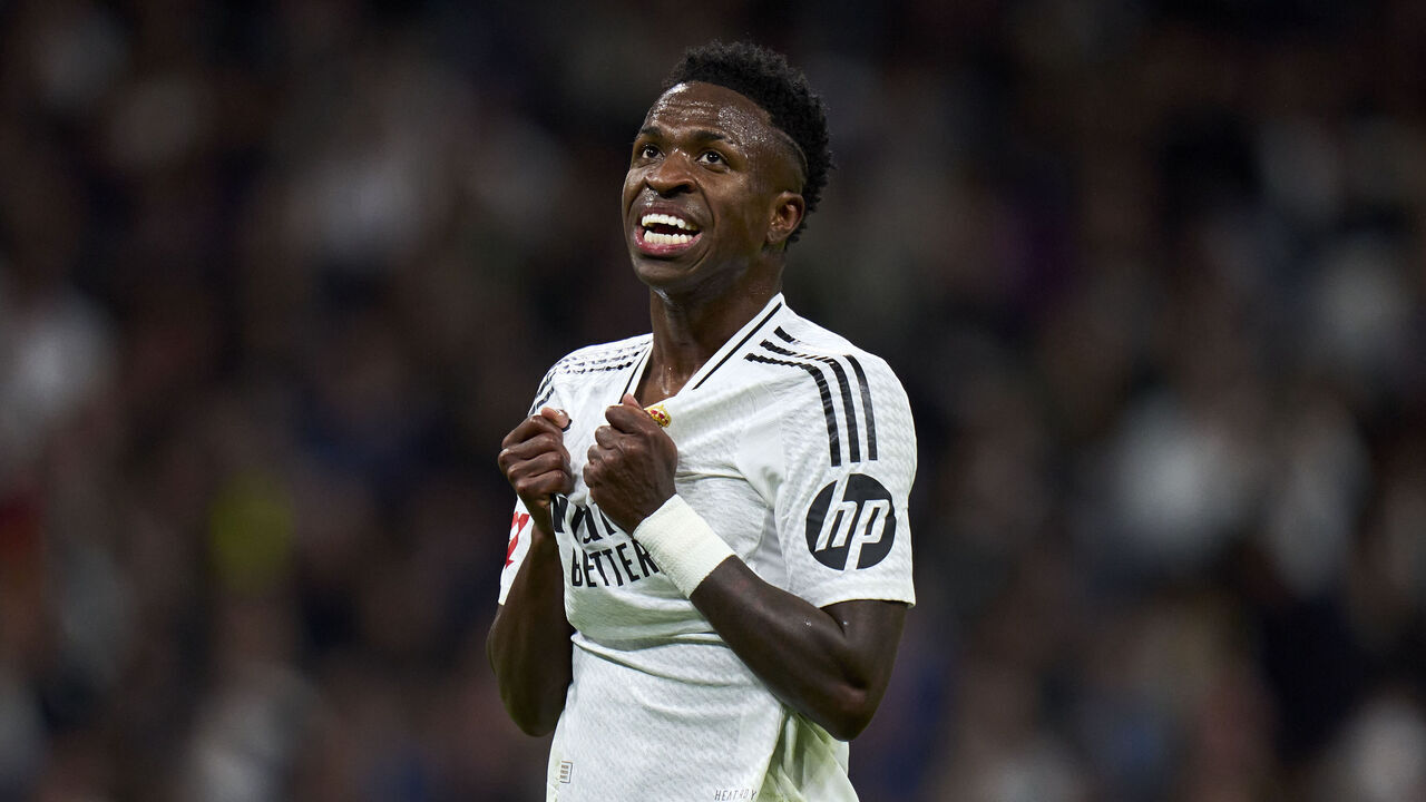 MADRID, SPAIN - OCTOBER 26: Vinicius Junior of Real Madrid CF reacts to a missed chance during the LaLiga match between Real Madrid CF and FC Barcelona at Estadio Santiago Bernabeu on October 26, 2024 in Madrid, Spain.