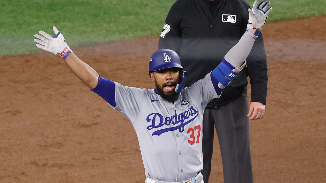 NEW YORK, NEW YORK - OCTOBER 30: Teoscar Hernández #37 of the Los Angeles Dodgers reacts after hitting a two-RBI double to tie the game during the fifth inning of Game Five of the 2024 World Series against the New York Yankees at Yankee Stadium on October 30, 2024 in the Bronx borough of New York City.