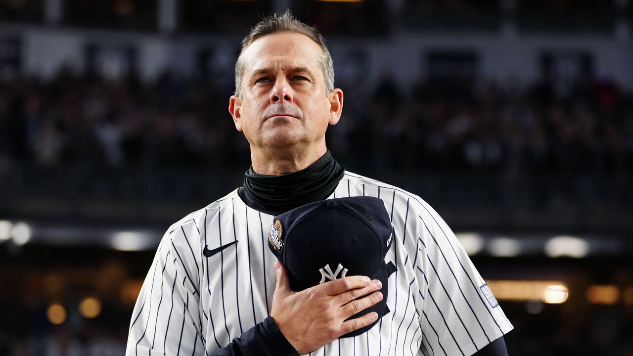 NEW YORK, NY - OCTOBER 28: Aaron Boone of the New York Yankees looks on during the national anthem prior to Game 3 of the 2024 World Series presented by Capital One between the Los Angeles Dodgers and the New York Yankees at Yankee Stadium on Monday, October 28, 2024 in New York, New York.
