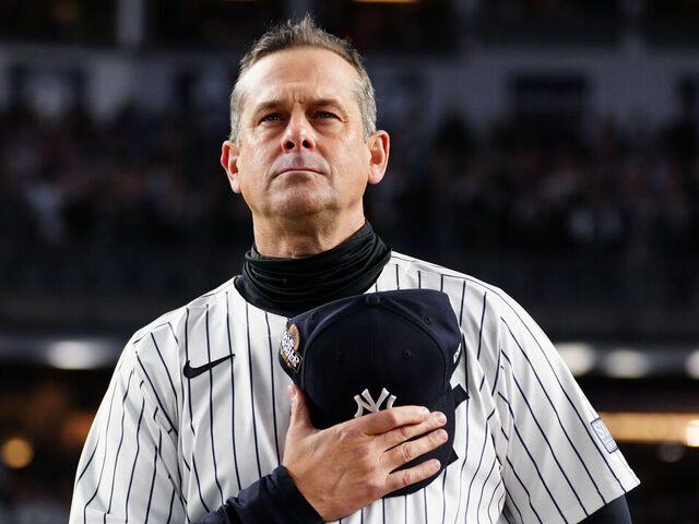 NEW YORK, NY - OCTOBER 28: Aaron Boone of the New York Yankees looks on during the national anthem prior to Game 3 of the 2024 World Series presented by Capital One between the Los Angeles Dodgers and the New York Yankees at Yankee Stadium on Monday, October 28, 2024 in New York, New York.