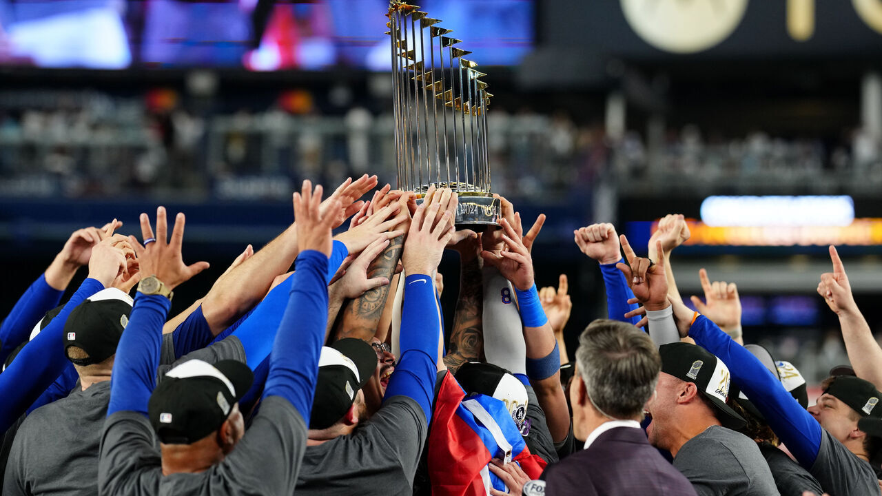 NEW YORK, NY - OCTOBER 30: Members of the Los Angeles Dodgers hoist the Commissioner's Trophy after the Dodgers defeated the New York Yankees in Game 5 to clinch the 2024 World Series presented by Capital One at Yankee Stadium on Wednesday, October 30, 2024 in New York, New York.
