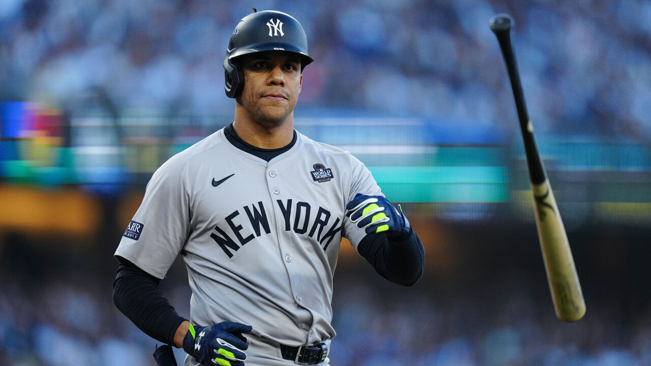LOS ANGELES, CA - OCTOBER 25: Juan Soto #22 of the New York Yankees tosses his bat after being walked in the first inning of Game 1 of the 2024 World Series presented by Capital One between the New York Yankees and the Los Angeles Dodgers at Dodger Stadium on Friday, October 25, 2024 in Los Angeles, California.