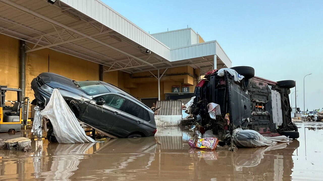 VALENCIA, SPAIN - OCTOBER 30: Vehicles are upended after flash floods and heavy rain hit the area on October 30, 2024 near kilometer 345 of A3 highway in Valencia, Spain. Spanish authorities said at least 72 people had died after flooding overnight and on the previous day. Spain's meteorological agency had issued its highest alert for the region due to extreme rainfall.