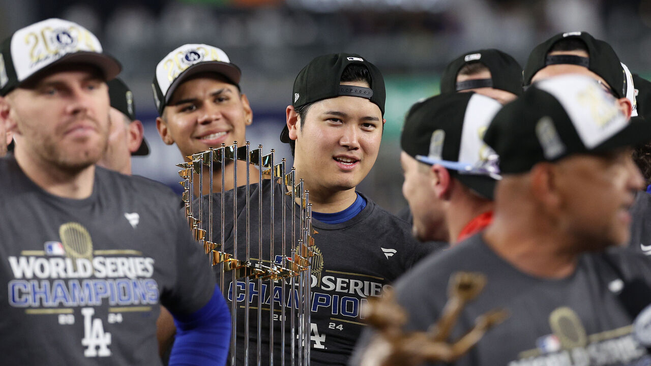 NEW YORK, NEW YORK - OCTOBER 30: Shohei Ohtani #17 of the Los Angeles Dodgers celebrates with the trophy after the Dodgers defeated the New York Yankees 7-6 in game 5 to win the 2024 World Series at Yankee Stadium on October 30, 2024 in the Bronx borough of New York City.