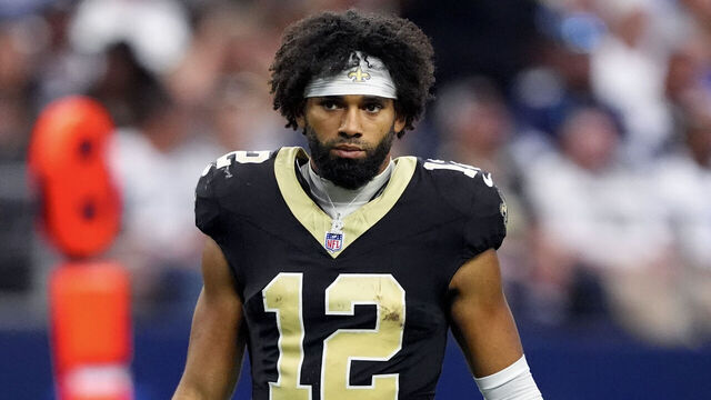 ARLINGTON, TEXAS - SEPTEMBER 15: Chris Olave #12 of the New Orleans Saints looks on during the second half against the Dallas Cowboys at AT&T Stadium on September 15, 2024 in Arlington, Texas.