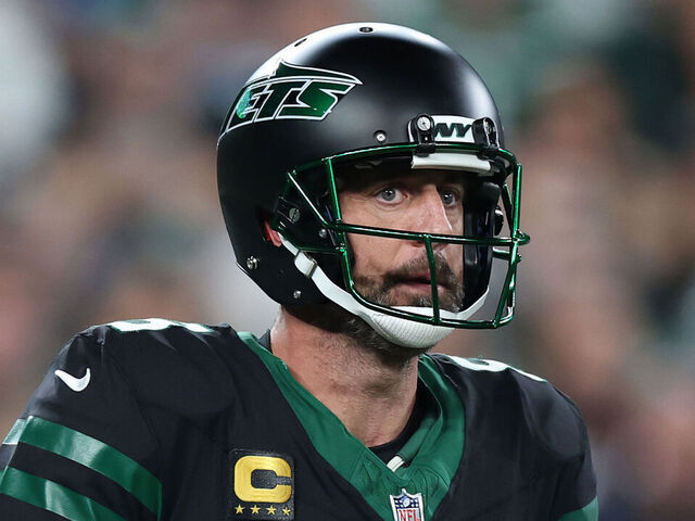 EAST RUTHERFORD, NEW JERSEY - OCTOBER 31: Aaron Rodgers #8 of the New York Jets looks to pass during the first quarter against the Houston Texans at MetLife Stadium on October 31, 2024 in East Rutherford, New Jersey.