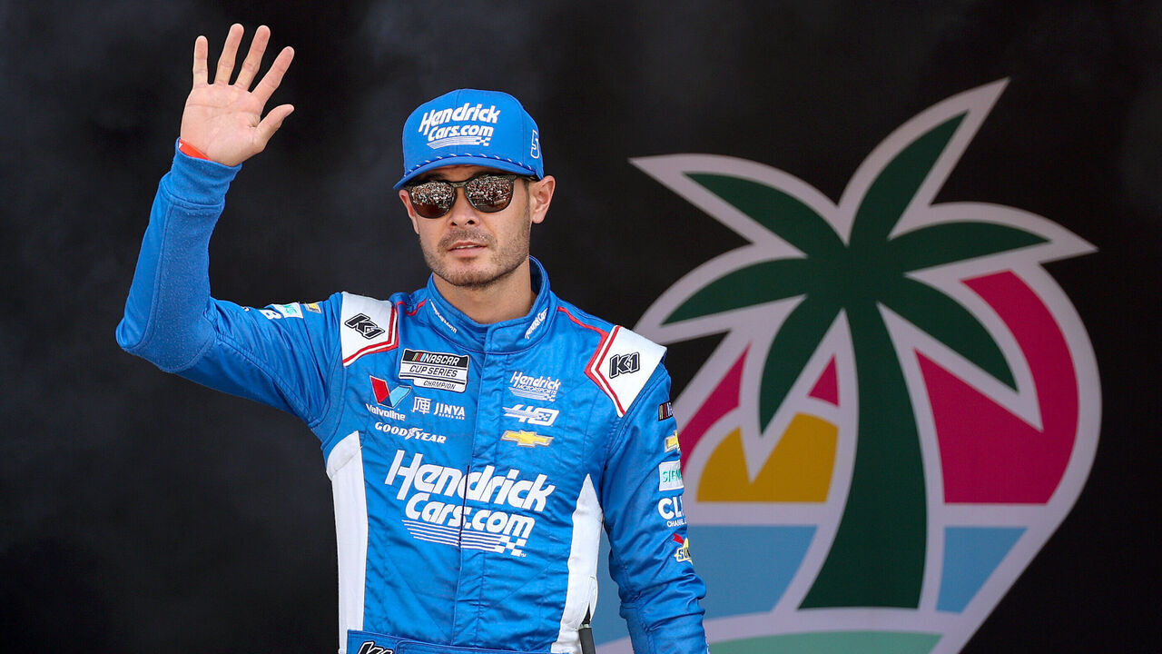 HOMESTEAD, FLORIDA - OCTOBER 27: Kyle Larson, driver of the #5 HendrickCars.com Chevrolet, waves to fans as he walks onstage during driver intros prior to the NASCAR Cup Series Straight Talk Wireless 400 at Homestead-Miami Speedway on October 27, 2024 in Homestead, Florida.