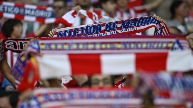 Atletico Madrid's supporters wave scarves before the start of the UEFA Champions League 1st round day 2 group E football match between Club Atletico de Madrid and Feyenoord at the Wanda Metropolitano stadium in Madrid on October 4, 2023.