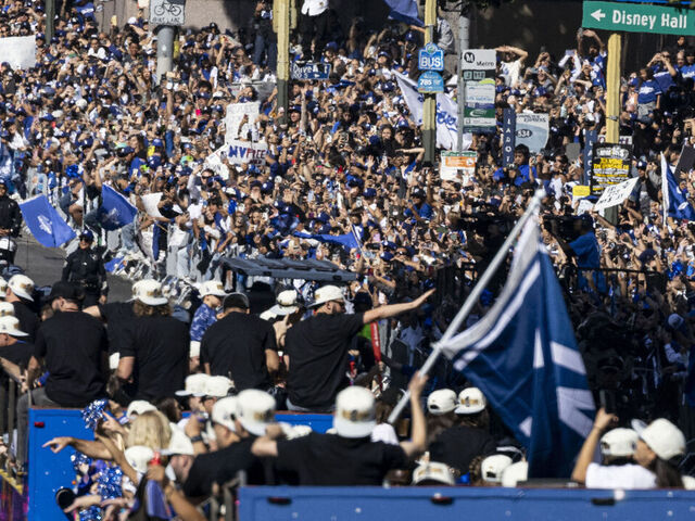 Los Angeles Dodgers' players, staff, families and friends celebrate with fans during the Dodgers' World Series championship parade in downtown Los Angeles on November 1, 2024. The Los Angeles Dodgers punished a string of defensive blunders from the New York Yankees to win the World Series on October 30 with a stunning come-from-behind 7-6 victory.