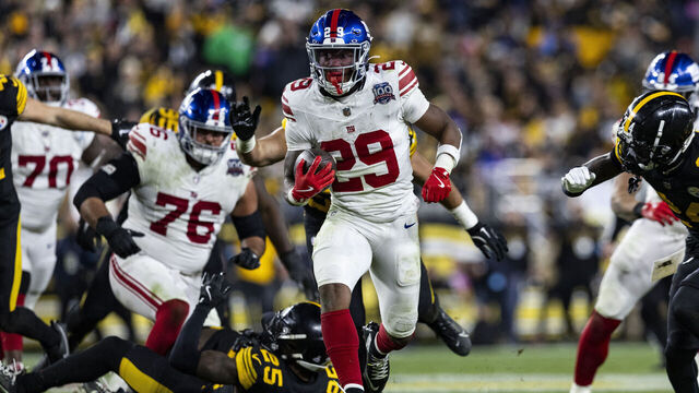 PITTSBURGH, PENNSYLVANIA - OCTOBER 28: Tyrone Tracy Jr. #29 of the New York Giants runs the ball to score a touchdown in the fourth quarter of the game against the Pittsburgh Steelers at Acrisure Stadium on October 28, 2024 in Pittsburgh, Pennsylvania. The Steelers beat the Giants 26-18.