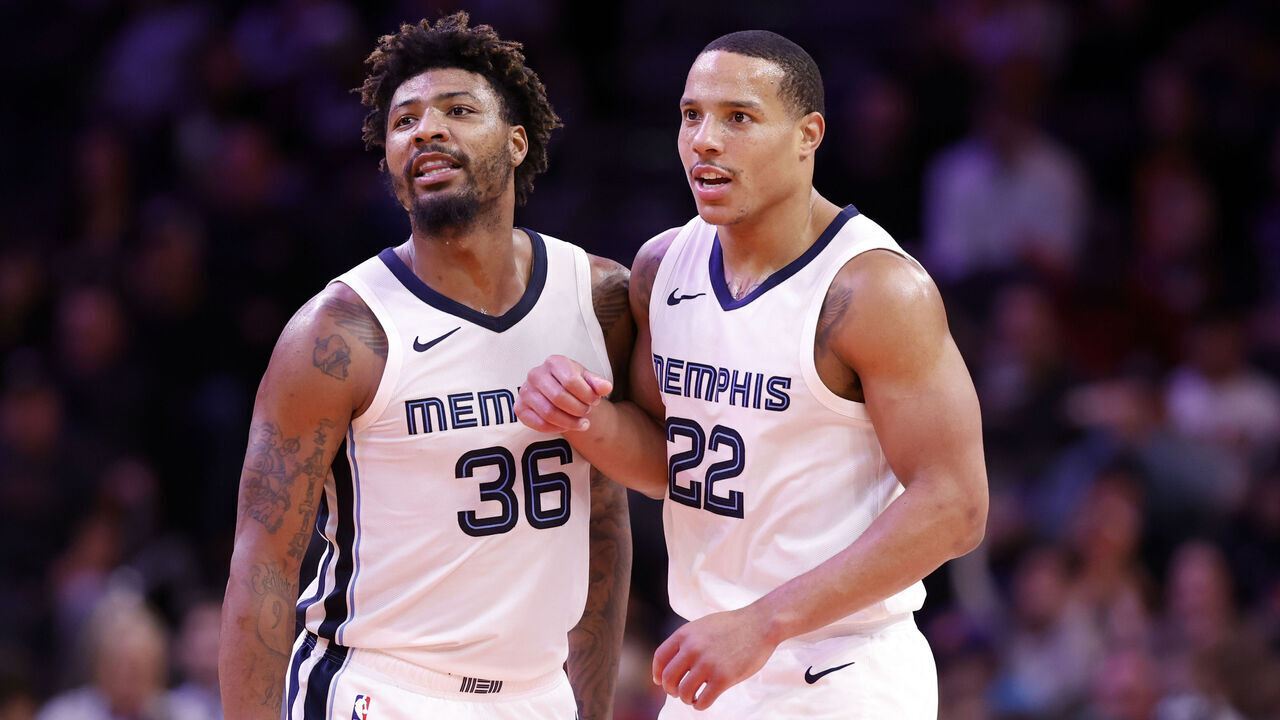PHOENIX, ARIZONA - JANUARY 07: Marcus Smart #36 of the Memphis Grizzlies and Desmond Bane #22 react after a basket during the game against the Phoenix Suns at Footprint Center on January 07, 2024 in Phoenix, Arizona. The Grizzlies defeated the Suns 121-115.
