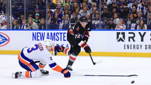 BUFFALO, NEW YORK - NOVEMBER 1: Tage Thompson #72 of the Buffalo Sabres shoots while defended by Adam Pelech #3 of the New York Islanders during an NHL game on November 1, 2024 at KeyBank Center in Buffalo, New York.