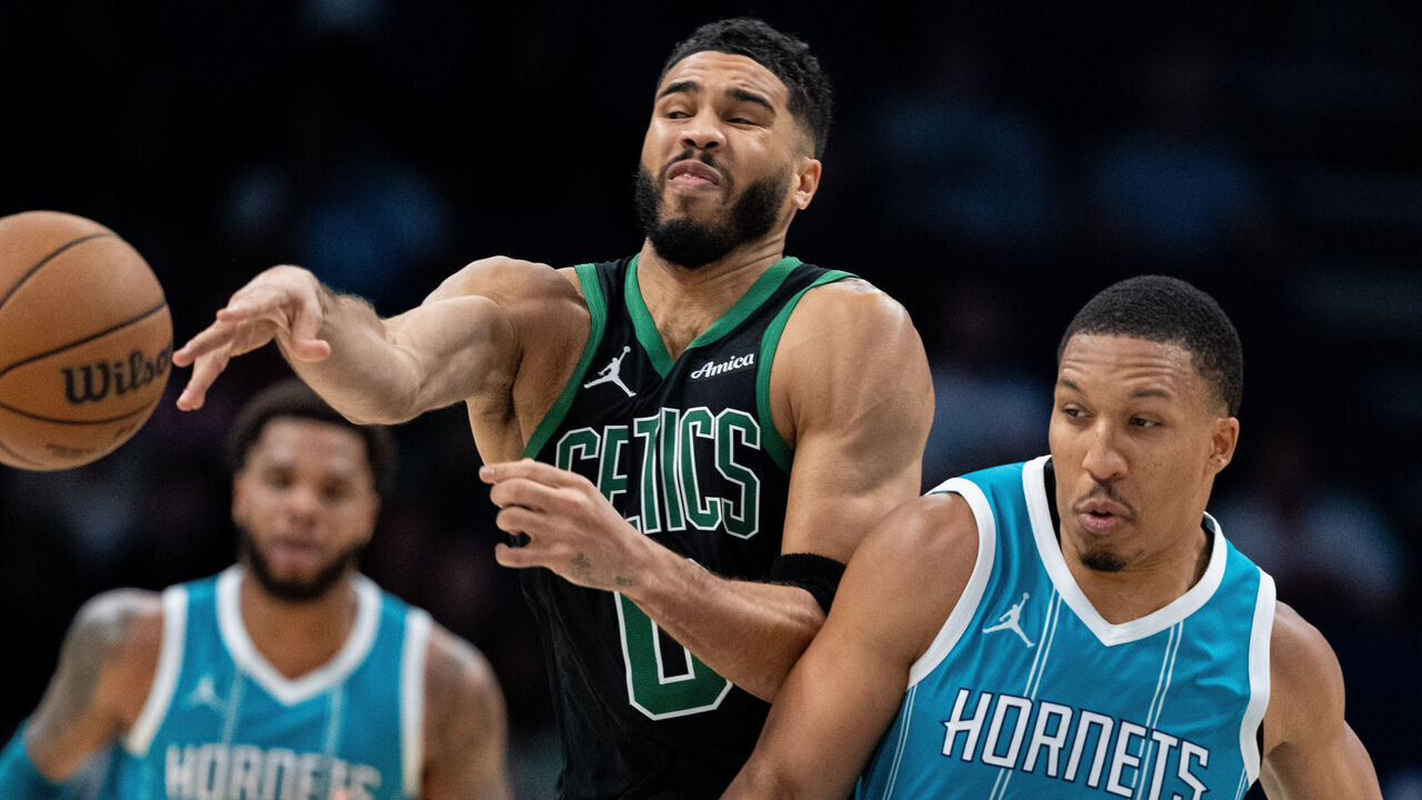 CHARLOTTE, NORTH CAROLINA - NOVEMBER 01: Grant Williams #2 of the Charlotte Hornets fouls Jayson Tatum #0 of the Boston Celtics in the fourth quarter during their game at Spectrum Center on November 01, 2024 in Charlotte, North Carolina.
