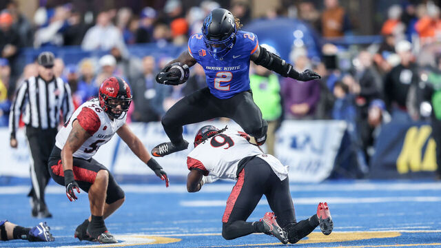 rBOISE, ID - NOVEMBER 01: Running back Ashton Jeanty #2 of the Boise State Broncos hurdles the tackle attempt of safety Dalesean Staley #9 of the San Diego State Aztecs during the first half at Albertsons Stadium on November 1, 2024 in Boise, Idaho.