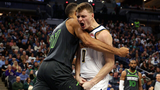 MINNEAPOLIS, MINNESOTA - NOVEMBER 01: Rudy Gobert #27 of the Minnesota Timberwolves and Christian Braun #0 of the Denver Nuggets get into a scrum in the fourth quarter. Gobert and Braun received technical fouls at Target Center on November 01, 2024 in Minneapolis, Minnesota. The Timberwolves defeated the Nuggets 119-116.