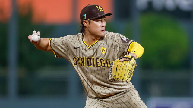DENVER, COLORADO - AUGUST 16: Ha-Seong Kim #7 of the San Diego Padres throws to first base for an out in the seventh inning during a game against the Colorado Rockies at Coors Field on August 16, 2024 in Denver, Colorado.