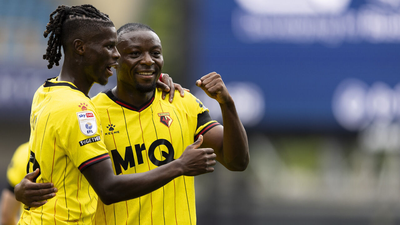 LONDON, ENGLAND - AUGUST 10: Edo Kayembe of Watford (right) celebrates with Vakoun Bayo after scoring his sides friar goal during the Sky Bet Championship match between Millwall FC and Watford FC at The Den on August 10, 2024 in London, England.