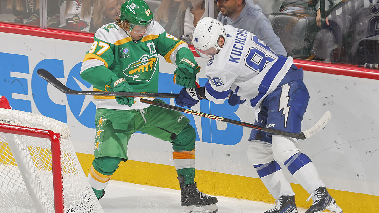 SAINT PAUL, MN - NOVEMBER 1: Kirill Kaprizov #97 of the Minnesota Wild and Nikita Kucherov #86 of the Tampa Bay Lightning battle for the puck during the game at the Xcel Energy Center on November 1, 2024 in Saint Paul, Minnesota.