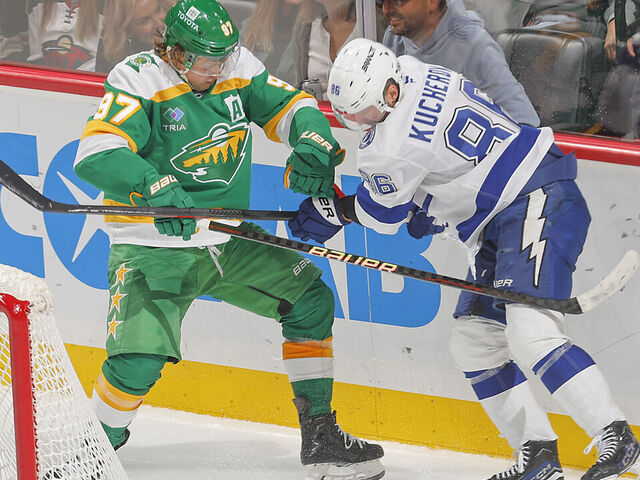 SAINT PAUL, MN - NOVEMBER 1: Kirill Kaprizov #97 of the Minnesota Wild and Nikita Kucherov #86 of the Tampa Bay Lightning battle for the puck during the game at the Xcel Energy Center on November 1, 2024 in Saint Paul, Minnesota.