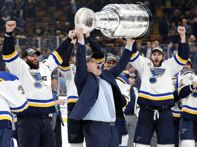 BOSTON, MA - JUNE 12: St. Louis Blues head coach Craig Berube lifts the Cup after Game 7 of the Stanley Cup Final between the Boston Bruins and the St. Louis Blues on June 12, 2019, at TD Garden in Boston, Massachusetts.