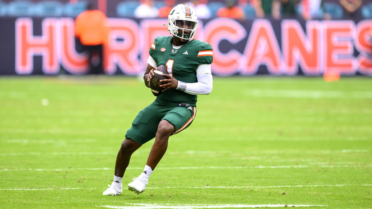 MIAMI GARDENS, FL - NOVEMBER 02: Miami quarterback Cam Ward (1) looks to throw the ball Miami wide receiver Xavier Restrepo (not shown) for a touchdown during the college football game between the Duke Blue Devils and the University of Miami Hurricanes on November 2, 2024 at the Hard Rock Stadium in Miami Gardens, FL.