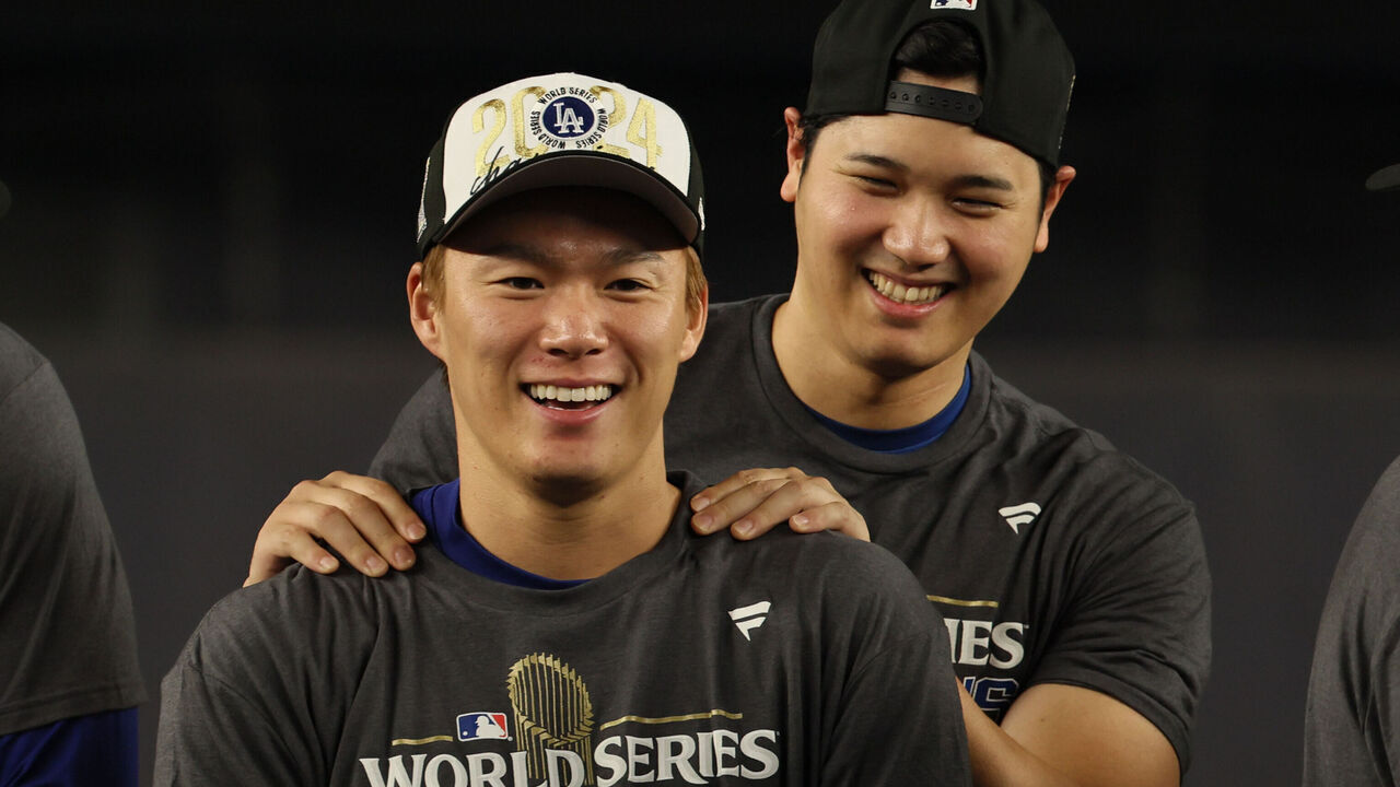 Bronx,, New York, Wednesday, October 30, 2024 - Dodgers teammates Shohei Ohtani and Yoshinobu Yamamoto celebrate winning the World Series championship at Yankee Stadium. (Robert Gauthier/Los Angeles Times via Getty Images)