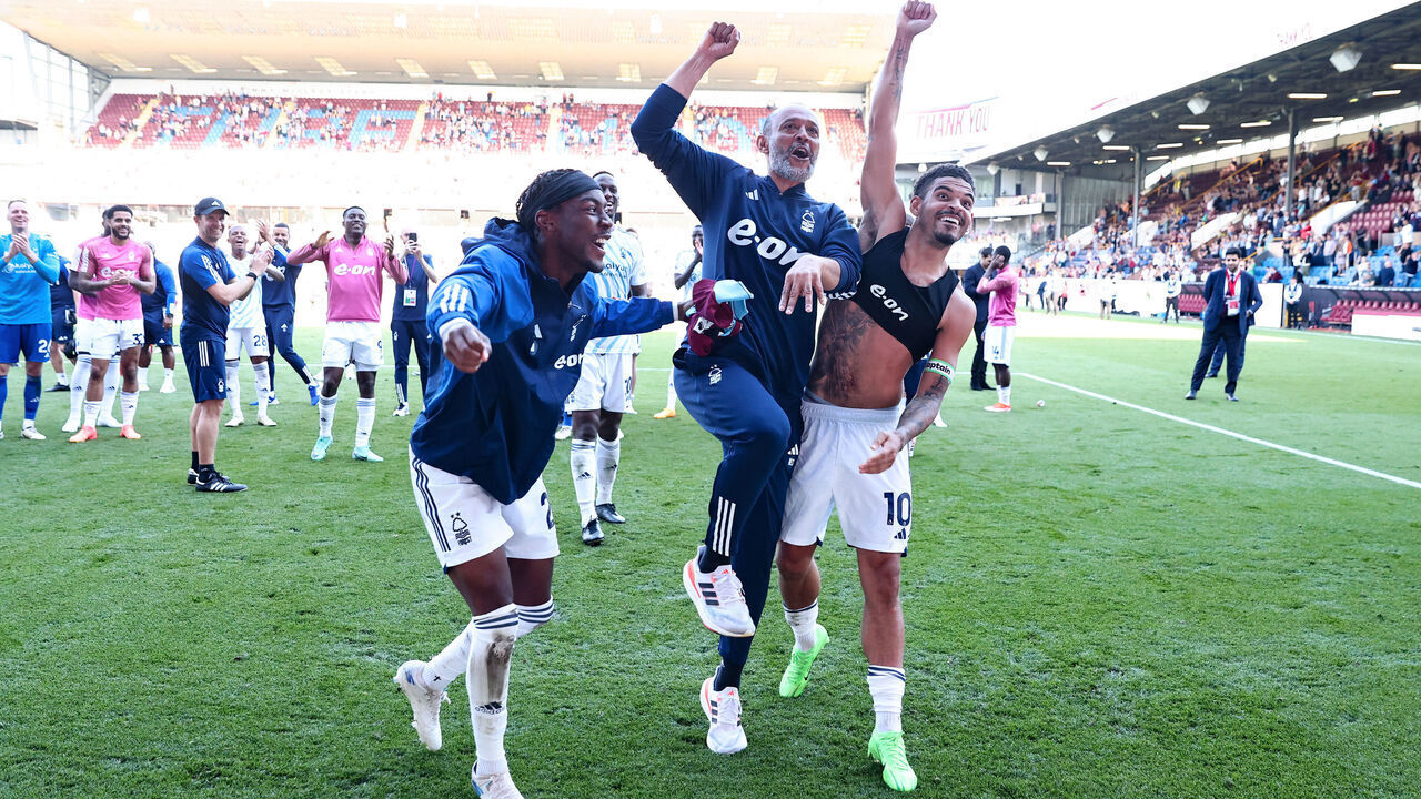 BURNLEY, ENGLAND - MAY 19: Nuno Espirito Santo, Manager of Nottingham Forest, celebrates victory with his players Anthony Elanga and Morgan Gibbs-White following the Premier League match between Burnley FC and Nottingham Forest at Turf Moor on May 19, 2024 in Burnley, England.