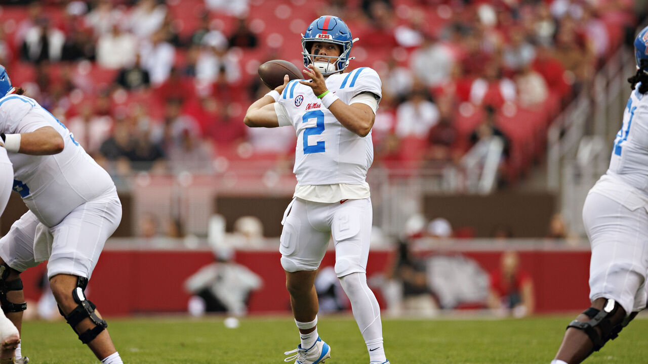 FAYETTEVILLE, ARKANSAS - NOVEMBER 02: Jaxson Dart #2 of the Ole Miss Rebels throws a pass in the first half during a game against the Arkansas Razorbacks at Donald W. Reynolds Razorback Stadium on November 02, 2024 in Fayetteville, Arkansas.