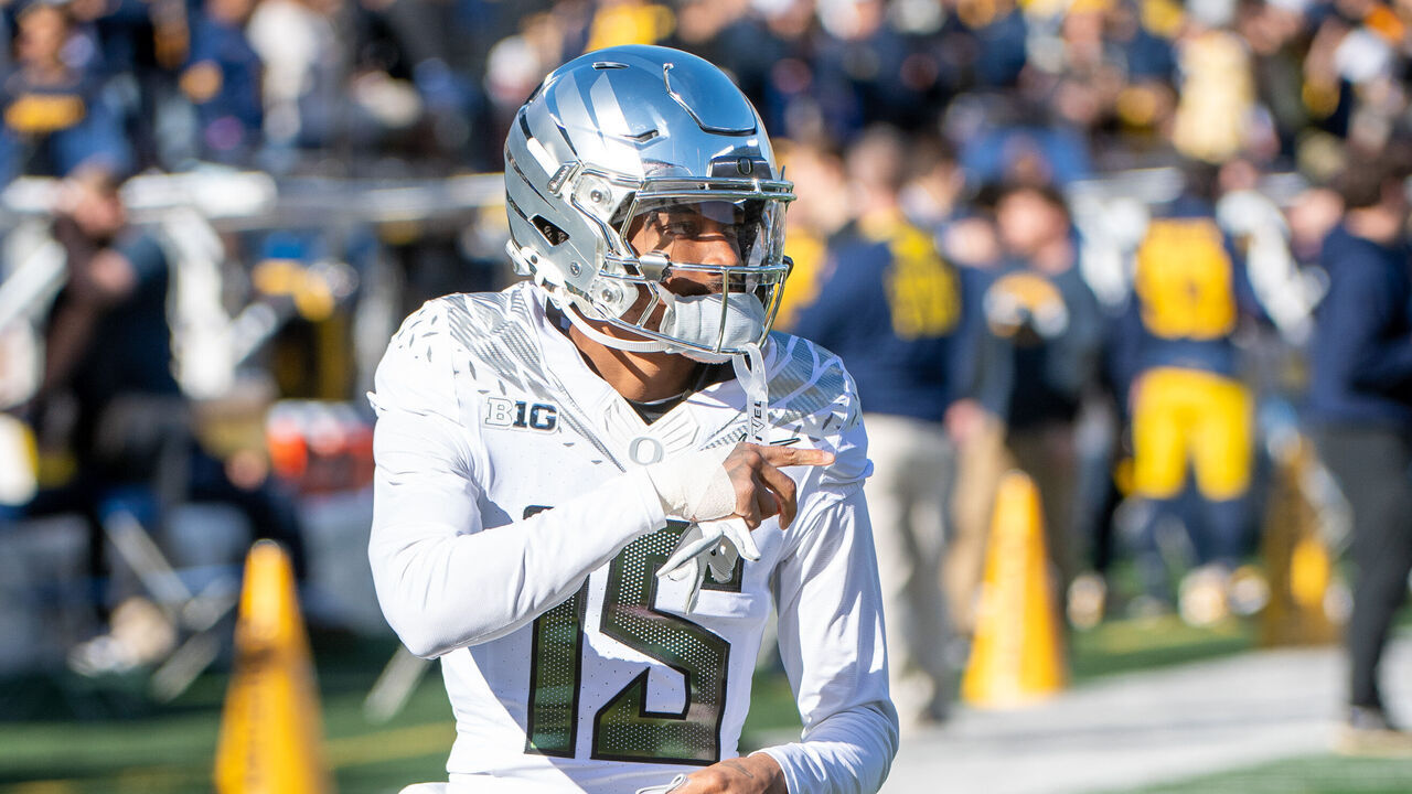 ANN ARBOR, MICHIGAN - NOVEMBER 02: Tez Johnson #15 of the Oregon Ducks warms up before a college football game against the Michigan Wolverines at Michigan Stadium on November 02, 2024 in Ann Arbor, Michigan.