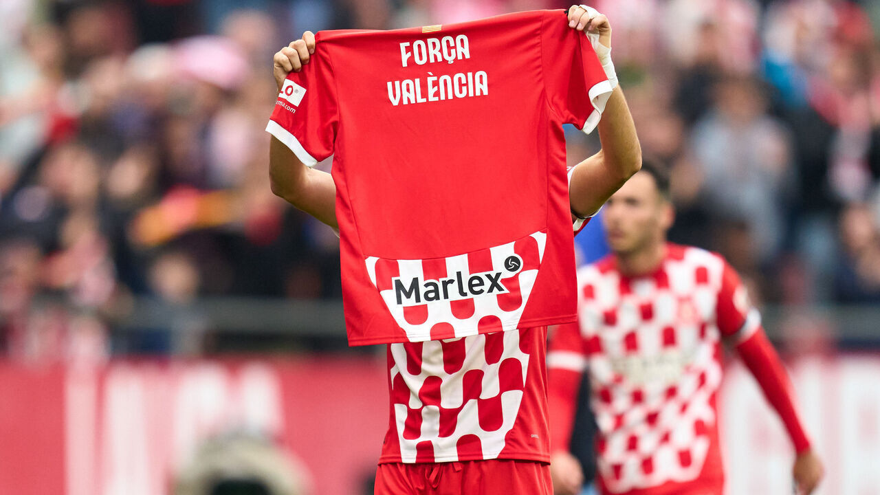 GIRONA, SPAIN - NOVEMBER 03: Miguel Gutierrez of Girona FC shows a shirt with a message in support of Valencia after the flash flooding in the Valencia region after scoring his team's first goal during the LaLiga match between Girona FC and CD Leganes at Montilivi Stadium on November 03, 2024 in Girona, Spain.