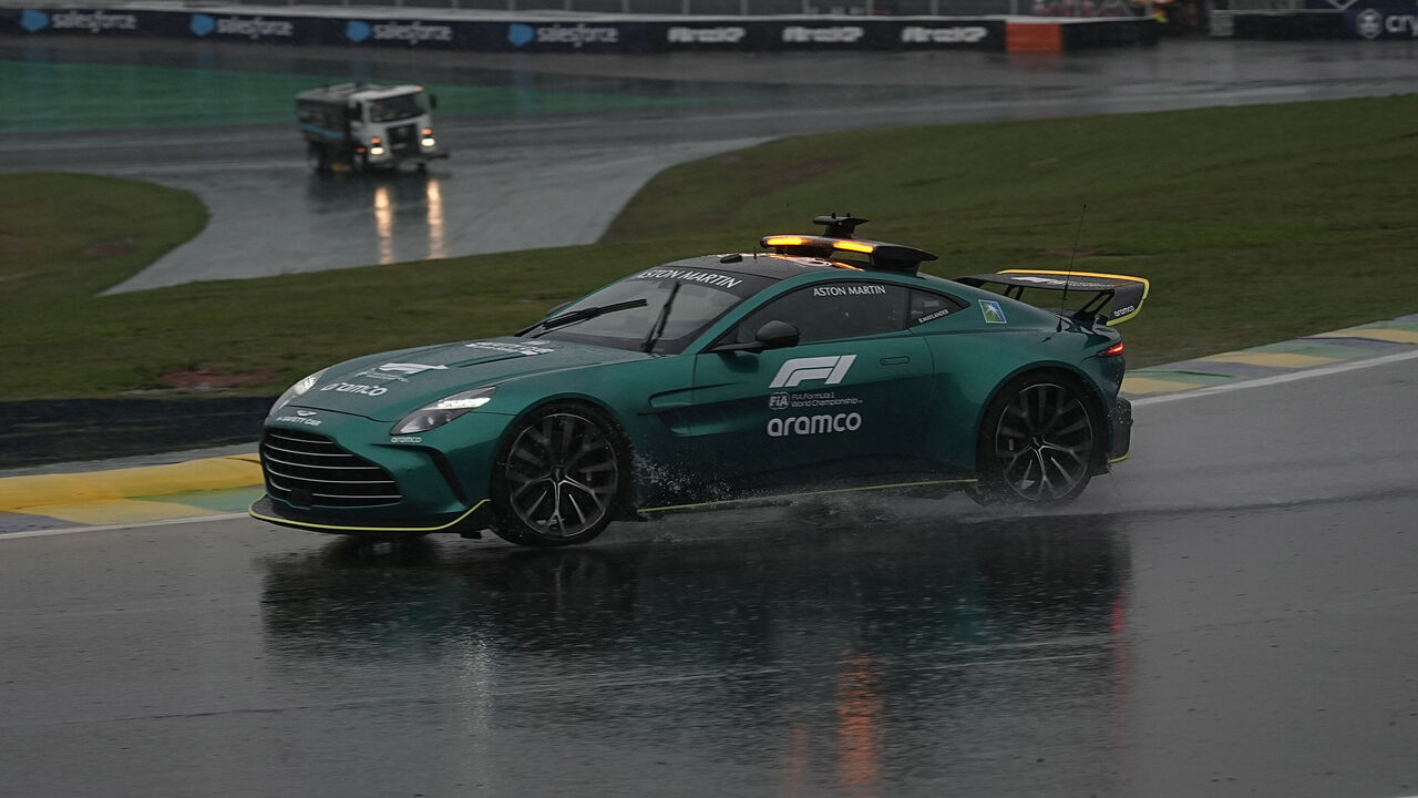 SAO PAULO, BRAZIL - NOVEMBER 2: Maintenance teams and race directors circulate around the Interlagos track to assess race conditions for qualifying, during a storm that hit the city of Sao Paulo on Saturday afternoon 2. After more than 1 hour of rain, qualifying was cancelled.