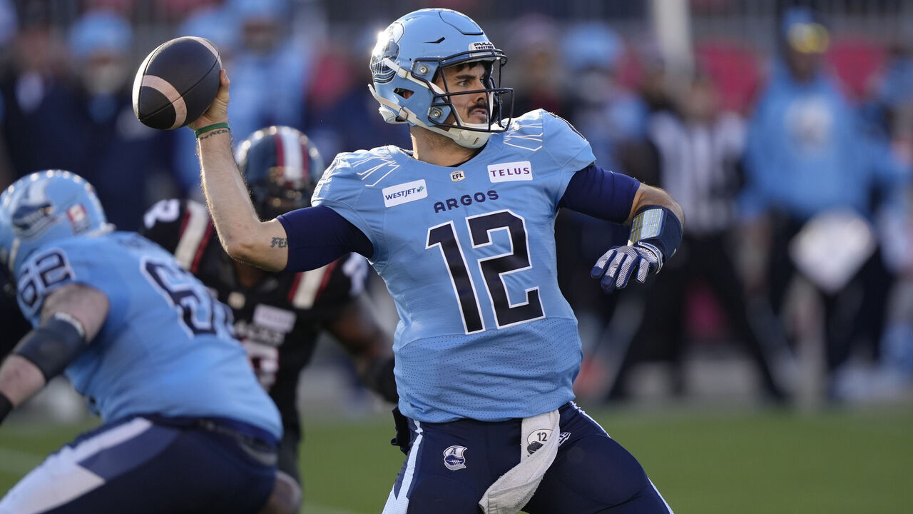 TORONTO, CANADA - NOVEMBER 2: Chad Kelly #12 of the Toronto Argonauts throws a touchdown pass to DaVaris Daniels (not pictured) against the Ottawa Redblacks during the first half of the CFL Eastern Semi-Final game at BMO Field on November 2, 2024 in Toronto, Canada.