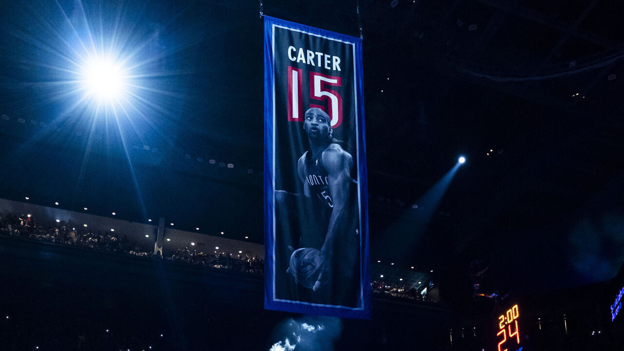 TORONTO, ON - NOVEMBER 2: Vince Carter, a former player of the Toronto Raptors, watches his banner go up with the number 15 during his jersey retirement ceremony at half time in the game between the Toronto Raptors and the Sacramento Kings at the Scotiabank Arena on November 2, 2024 in Toronto, Ontario, Canada. NOTE TO USER: User expressly acknowledges and agrees that, by downloading and/or using this Photograph, user is consenting to the terms and conditions of the Getty Images License Agreement.