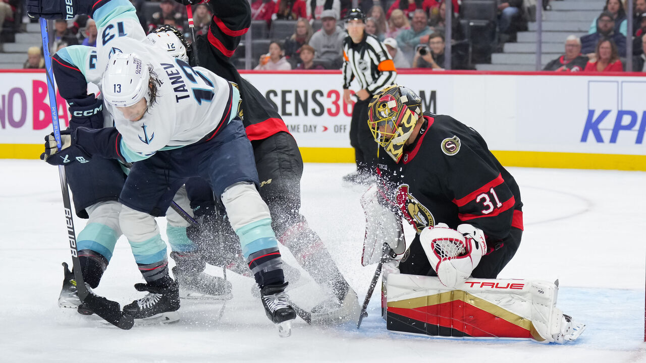 OTTAWA, CANADA - NOVEMBER 02: Brandon Tanev #13 of the Seattle Kraken attempts to deflect the puck on Anton Forsberg #31 of the Ottawa Senators during the first period at Canadian Tire Centre on November 02, 2024 in Ottawa, Ontario, Canada.