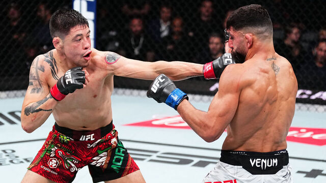 EDMONTON, ALBERTA - NOVEMBER 02: (L-R) Brandon Moreno of Mexico punches Amir Albazi of Iraq in a flyweight fight during the UFC Fight Night event at Rogers Place on November 02, 2024 in Edmonton, Alberta.