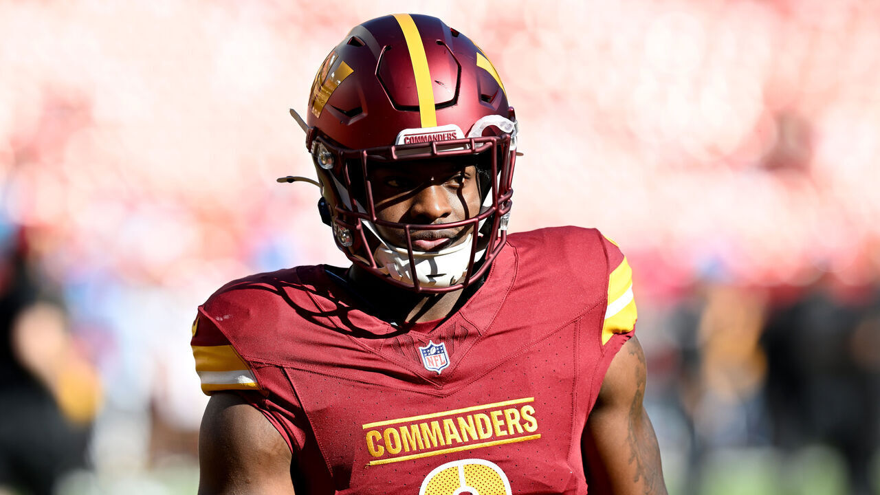 LANDOVER, MARYLAND - OCTOBER 20: Brian Robinson Jr. #8 of the Washington Commanders warms up before the game against the Carolina Panthers at Northwest Stadium on October 20, 2024 in Landover, Maryland.