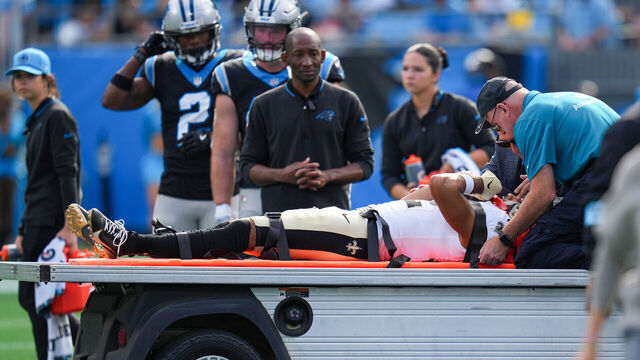 CHARLOTTE, NORTH CAROLINA - NOVEMBER 03: Chris Olave #12 of the New Orleans Saints leaves the field after an injury during the first quarter against the Carolina Panthers at Bank of America Stadium on November 03, 2024 in Charlotte, North Carolina.