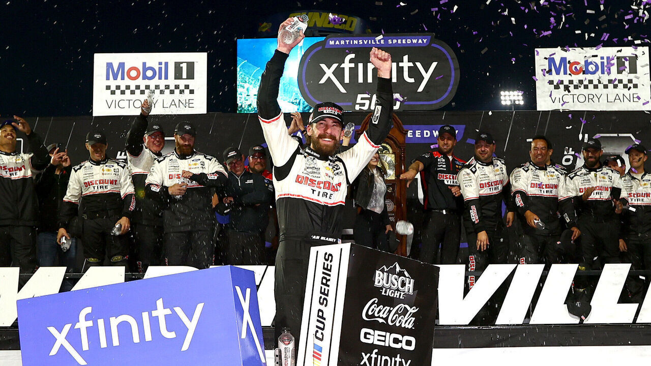 MARTINSVILLE, VIRGINIA - NOVEMBER 03: Ryan Blaney, driver of the #12 Discount Tire Ford, celebrates in victory lane after winning the NASCAR Cup Series Xfinity 500 at Martinsville Speedway on November 03, 2024 in Martinsville, Virginia.