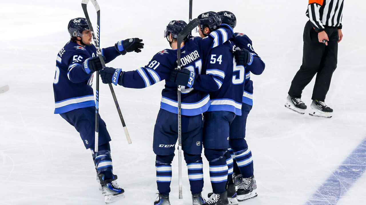 WINNIPEG, CANADA - NOVEMBER 3: Mark Scheifele #55, Kyle Connor #81, Dylan Samberg #54 and Dylan DeMelo #2 of the Winnipeg Jets celebrate a third period goal against the Tampa Bay Lightning at the Canada Life Centre on November 3, 2024 in Winnipeg, Manitoba, Canada.