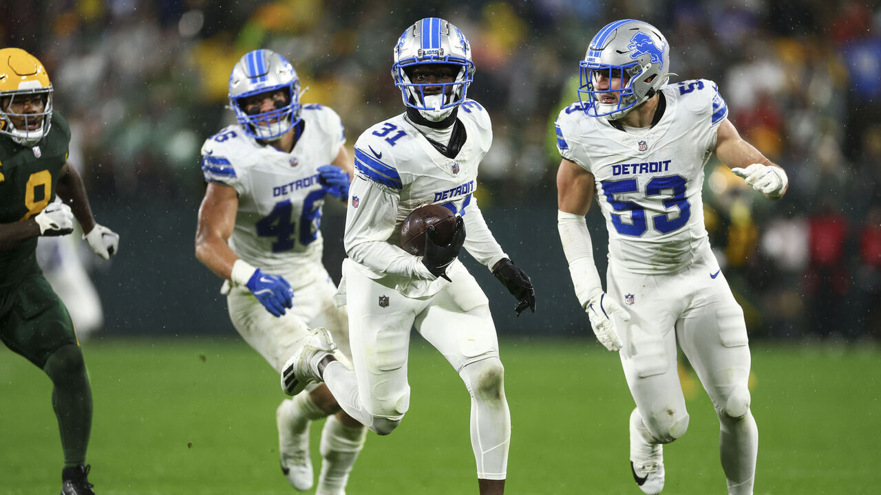 GREEN BAY, WISCONSIN - NOVEMBER 03: Kerby Joseph #31 of the Detroit Lions returns a fumble for a touchdown during the first half of an NFL football game against the Green Bay Packers at Lambeau Field on November 3, 2024 in Green Bay, Wisconsin.