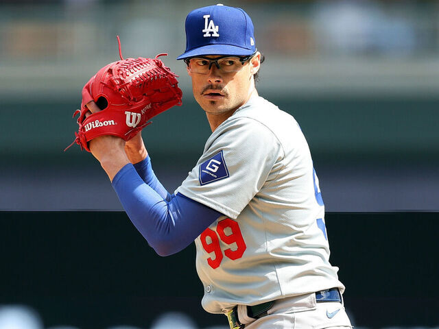 MINNEAPOLIS, MINNESOTA - APRIL 10: Joe Kelly #99 of the Los Angeles Dodgers delivers a pitch against the Minnesota Twins in the eighth inning at Target Field on April 10, 2024 in Minneapolis, Minnesota. The Twins defeated the Dodgers 3-2.