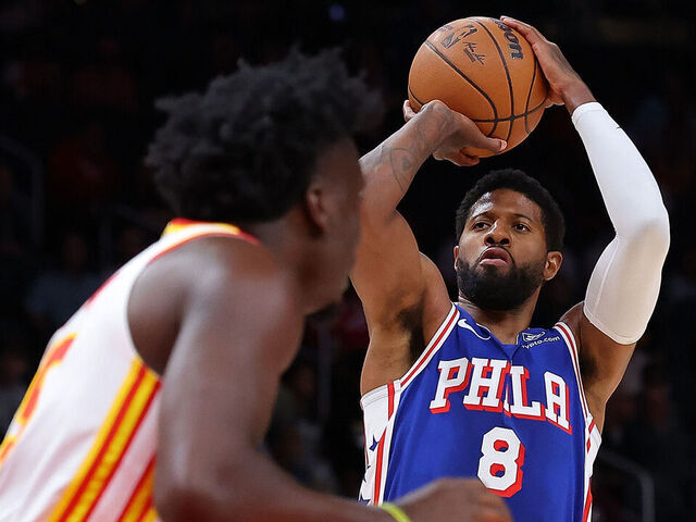 ATLANTA, GEORGIA - OCTOBER 14: Paul George #8 of the Philadelphia 76ers attempts a shot against Clint Capela #15 of the Atlanta Hawks during the first quarter at State Farm Arena on October 14, 2024 in Atlanta, Georgia. NOTE TO USER: User expressly acknowledges and agrees that, by downloading and/or using this photograph, user is consenting to the terms and conditions of the Getty Images License Agreement.