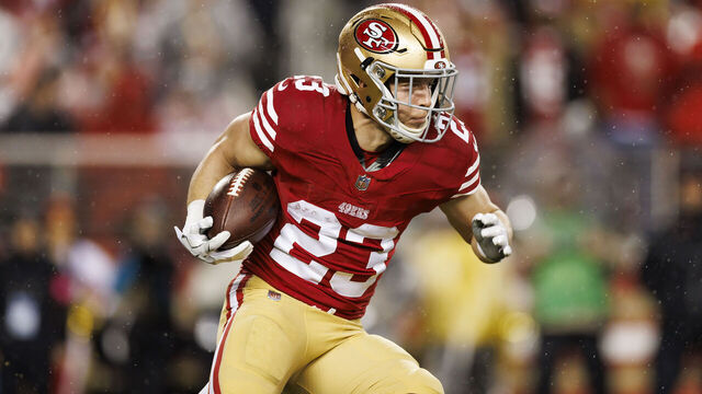 SANTA CLARA, CALIFORNIA - JANUARY 20: Christian McCaffrey #23 of the San Francisco 49ers carries the ball on a run play during an NFC divisional round playoff football game against the Green Bay Packers at Levi's Stadium on January 20, 2024 in Santa Clara, California.